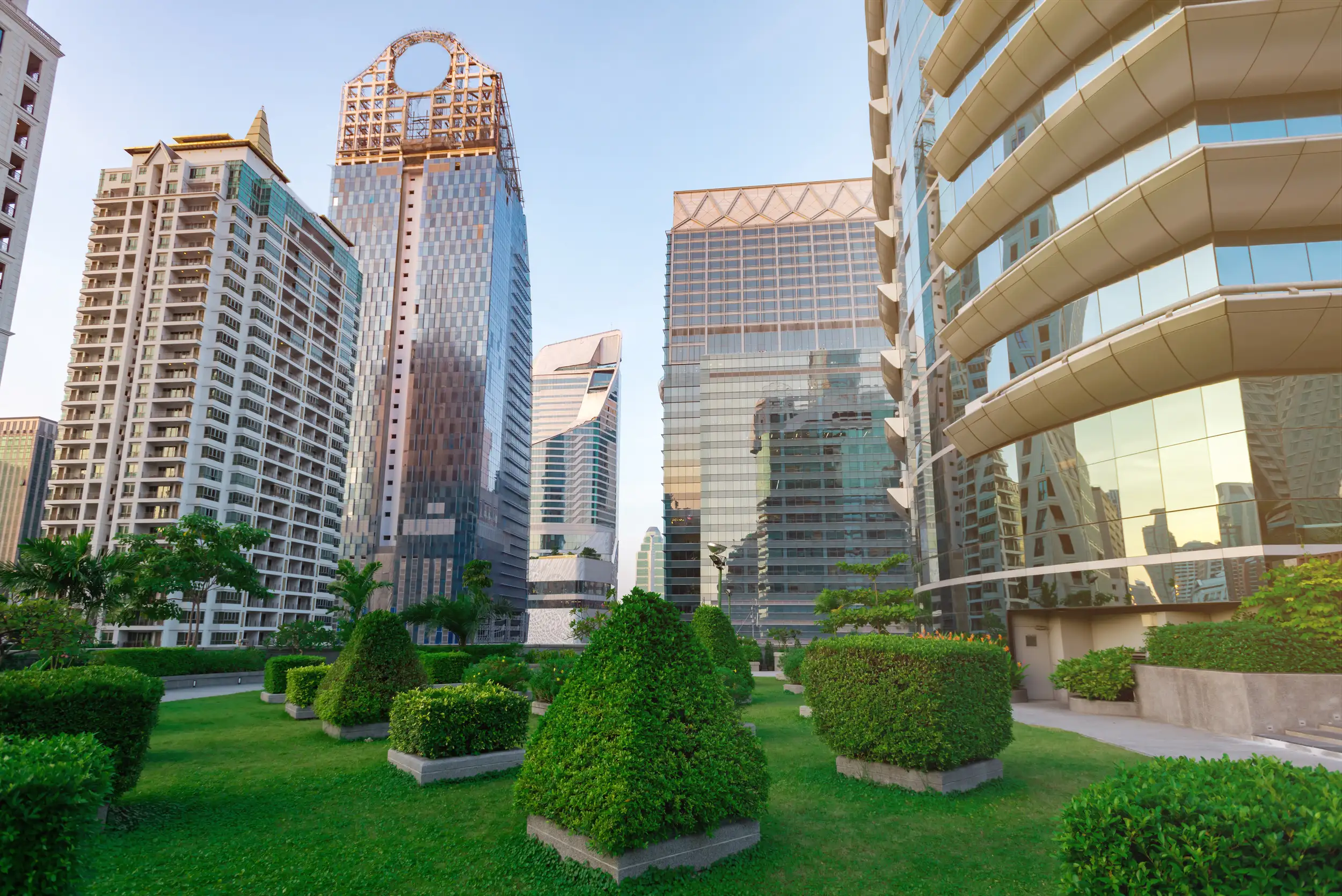 A commercial building with great landscape in the front.